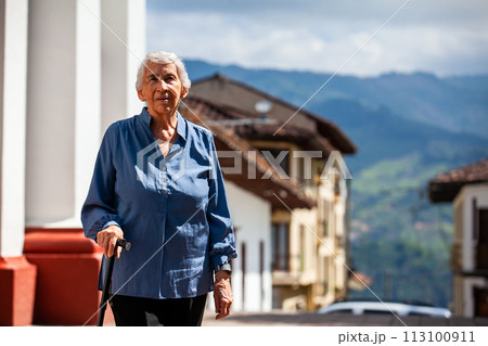 Senior woman tourist at the beautiful heritage town of Salamina in the department of Caldas in Colombia 113100911