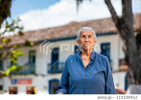 Senior woman tourist at the beautiful heritage town of Salamina in the department of Caldas in Colombia 113100912