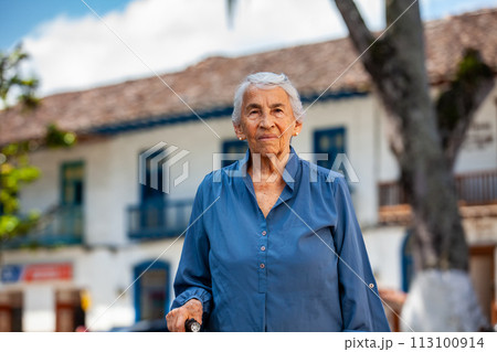 Senior woman tourist at the beautiful heritage town of Salamina in the department of Caldas in Colombia 113100914