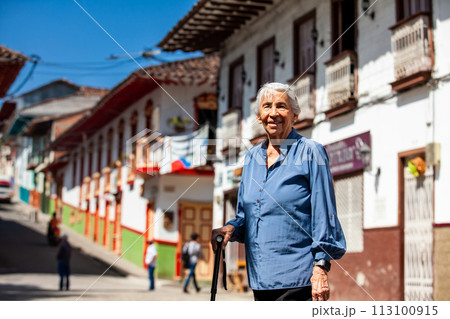 Senior woman tourist at the beautiful heritage town of Salamina in the department of Caldas in Colombia 113100915