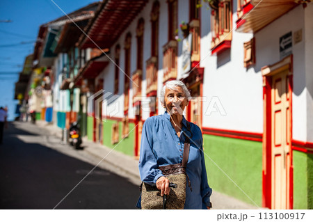 Senior woman tourist at the beautiful heritage town of Salamina in the department of Caldas in Colombia 113100917