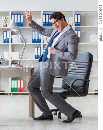 Businessman having fun taking a break in the office at work Businessman having fun taking a break in the office at work 113101001
