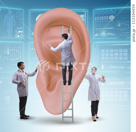 Doctor examining giant ear in medical concept 113104459