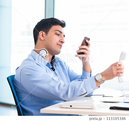Male call-center operator in business concept 113105386