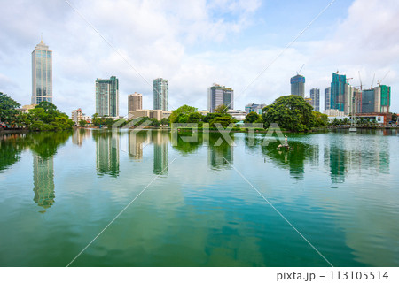 View of Colombo cityscape and skyscrapers reflection on Beira Lake a lake in the center of the city. Colombo is the commercial capital and largest city of Sri Lanka. 113105514