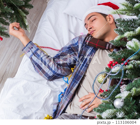 Man suffering hangover after christmas party 113106004