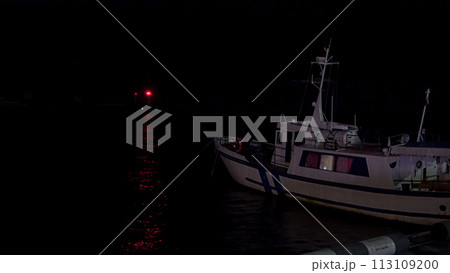 Fishing boat at the pier at night. Fishing boat at the pier at night. 113109200