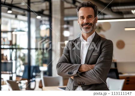 Confident Businessman  happy executive colleagues partners having conversation discussing standing in Modern corporate office 113111147
