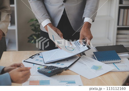 Finance manager meeting discussing company growth project success financial statistics, professional investor working start up project for strategy plan with document, laptop and digital tablet. 113112160