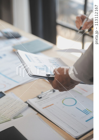 Finance manager meeting discussing company growth project success financial statistics, professional investor working start up project for strategy plan with document, laptop and digital tablet. 113112167