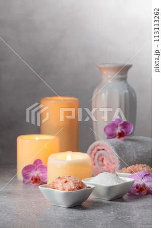 Sea salt, towels, orchid flowers, and burning candles. Sea salt, towels, orchid flowers, and burning candles. 113113262