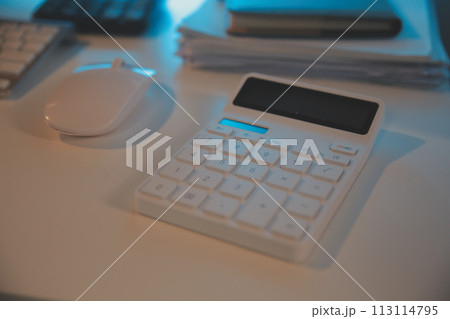 Laptop and paperwork on conference table Laptop and paperwork on conference table 113114795