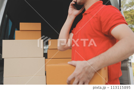 Asian delivery express courier young man use giving boxes to woman customer he wearing protective face mask at front home 113115895