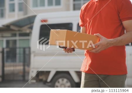 Asian delivery express courier young man use giving boxes to woman customer he wearing protective face mask at front home 113115904