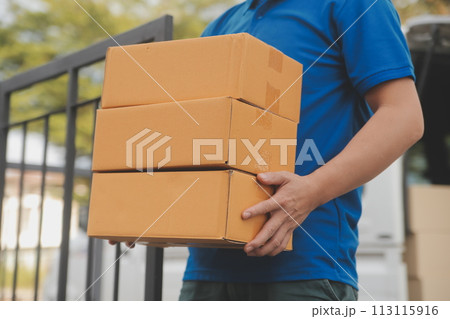 Asian delivery express courier young man use giving boxes to woman customer he wearing protective face mask at front home Asian delivery express courier young man use giving boxes to woman customer he wearing protective face mask at front home 113115916
