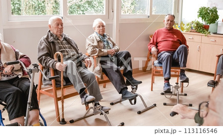 Senior people doing pedal exercises at rehabilitation center 113116546