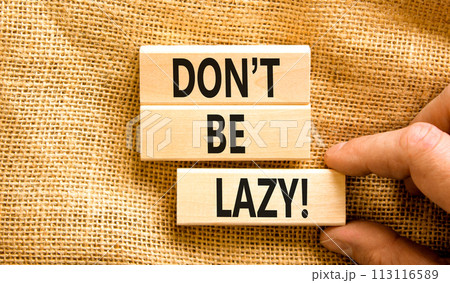 Motivational and do not be lazy symbol. Concept words Do not be lazy on wooden blocks on a beautiful canvas table canvas background. Businessman hand. Business do not be lazy concept. Copy space. 113116589