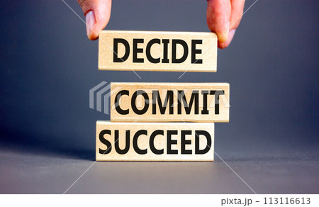 Decide commit succeed symbol. Concept word Decide Commit Succeed on beautiful wooden block. Businessman hand. Beautiful grey table background. Business decide commit succeed concept. Copy space. 113116613