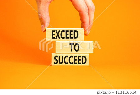 Exceed to succeed symbol. Concept words Exceed to succeed on beautiful wooden blocks. Beautiful orange table orange background. Businessman hand. Business and exceed to succeed concept. Copy space. 113116614