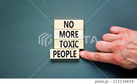 No more toxic people symbol. Concept words No more toxic people on wooden blocks on a beautiful grey table grey background. Psychologist hand. Business, psychological no more toxic people concept. No more toxic people symbol. Concept words No more toxic people on wooden blocks on a beautiful grey table grey background. Psychologist hand. Business, psychological no more toxic people concept. 113116639