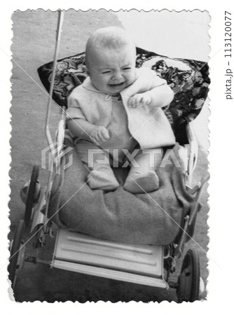 Vintage photo of a boy in a stroller. The baby is crying. Photo from 1961 113120077