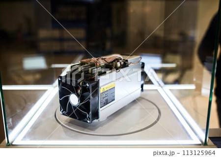 Cryptocurrency mining equipment - ASIC - application specific integrated circuit on farm stand at expo Cryptocurrency mining equipment - ASIC - application specific integrated circuit on farm stand at expo 113125964