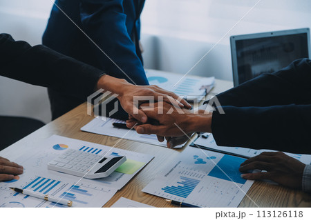 Business people join hands to join forces as a teamwork. Business people join hands to join forces as a teamwork. 113126118