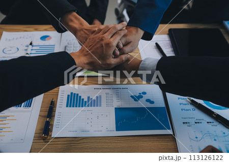 Business people join hands to join forces as a teamwork. Business people join hands to join forces as a teamwork. 113126122