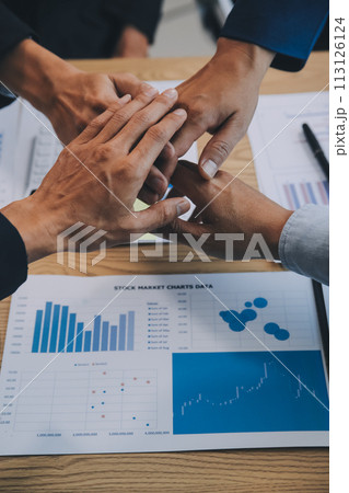 Business people join hands to join forces as a teamwork. 113126124