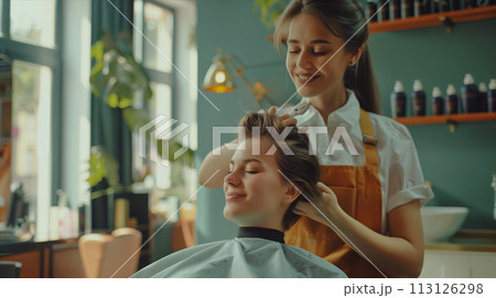 Caucasian woman cutting hair of customer in hair salon. Caucasian woman cutting hair of customer in hair salon. 113126298