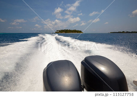 Tail of the sea from the speed boat on a sunny day on Maldives Tail of the sea from the speed boat on a sunny day on Maldives 113127758