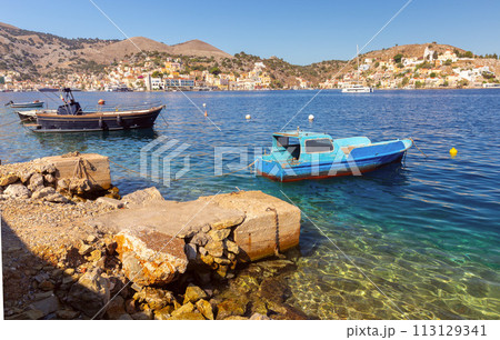 Wooden fishing boats near the shore in Sumi village on a sunny day. 113129341