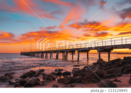 Robe pier with fishermen during early morning sunrise Robe pier with fishermen during early morning sunrise 113129945