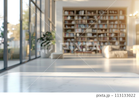 A white room with a wooden table and a shelf full of books 113133022
