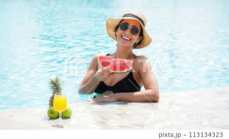 Summer time and Vacations. Women lifestyle relaxing and drinking juice orange Summer time and Vacations. Women lifestyle relaxing and drinking juice orange 113134323