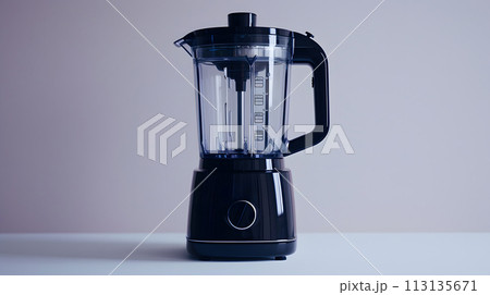 A sleek black blender contrasts against the white table A sleek black blender contrasts against the white table 113135671