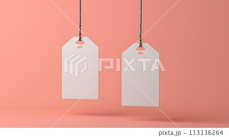 White tags on a pink background, hanging from a string 113136264