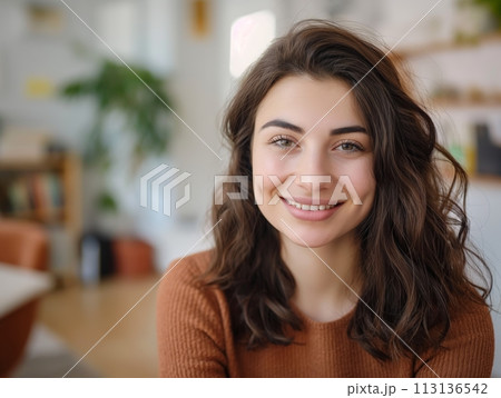 A beautiful, smiling young woman with a confident and pretty face, exuding warmth and happiness A beautiful, smiling young woman with a confident and pretty face, exuding warmth and happiness 113136542