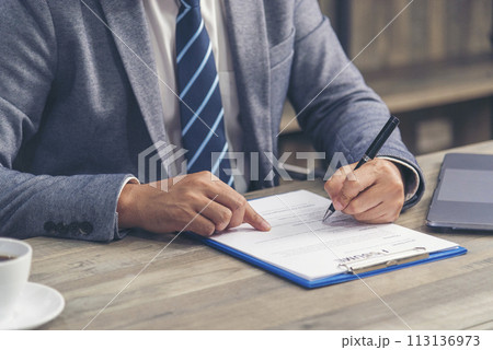 Close up manager businessman hands sign contract working meeting. Asian business man using pen signing on new contract to starting projects in conference room.  Business agreement concepts. 113136973