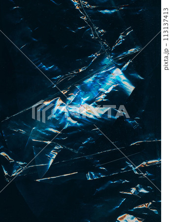 Distressed foil. Old film overlay. Blue orange color glow dust scratches wrinkled worn uneven texture dark black illustration art abstract background. Distressed foil. Old film overlay. Blue orange color glow dust scratches wrinkled worn uneven texture dark black illustration art abstract background. 113137413