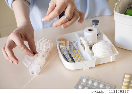 Female hands blister pills pack first kit aid storage organization. Vitamin, painkiller, cure supply 113139337