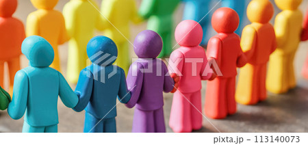colorful figurines hold hands in unity, representing diverse community. Each color signifies unique identity, showcasing harmony in diversity. concept of inclusivity 113140073