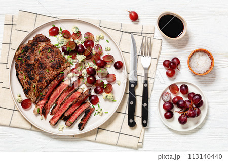 fried beef steak with salad of grape, cheese 113140440