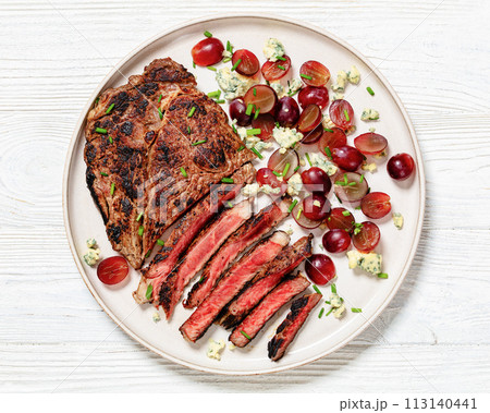 fried beef steak with salad of grape, cheese 113140441