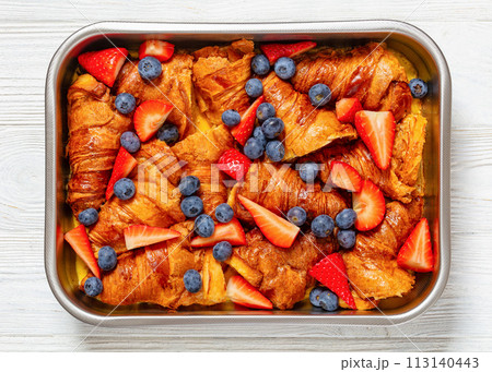 berry croissant casserole in baking dish, top view 113140443