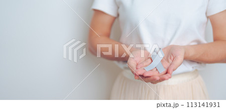 Brain Cancer Awareness May month, woman with grey color Ribbon for supporting life people. Healthcare and World cancer day concept Brain Cancer Awareness May month, woman with grey color Ribbon for supporting life people. Healthcare and World cancer day concept 113141931