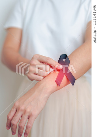 Melanoma and skin cancer, Vaccine injury awareness month and rest in peace concepts. woman holding black Ribbon Melanoma and skin cancer, Vaccine injury awareness month and rest in peace concepts. woman holding black Ribbon 113141946