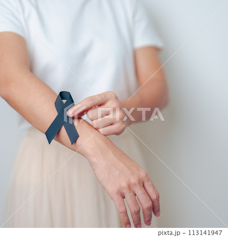 Melanoma and skin cancer, Vaccine injury awareness month and rest in peace concepts. woman holding black Ribbon Melanoma and skin cancer, Vaccine injury awareness month and rest in peace concepts. woman holding black Ribbon 113141947