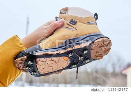 Ice grips for walking on icy or slippery surfaces, traction tread outsole and cleats simultaneously contact walking surface, providing superior grip on ice, snow, and pavement. 113142177