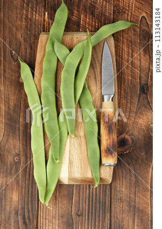 Fresh runner beans on wooden background. 113143184